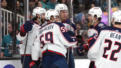 Columbus Blue Jackets right wing Kirill Marchenko (left) celebrates with teammates after scoring a goal against the San Jose Sharks during the first period at SAP Center at San Jose.