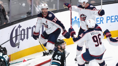 Columbus Blue Jackets' Boone Jenner celebrates with Damon Severson and Jack Roslovic after scoring a goal against the San Jose Sharks during the second period at SAP Center at San Jose.