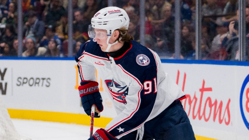 Columbus Blue Jackets forward Kent Johnson (91) handles the puck against the Vancouver Canucks in the first period at Rogers Arena.