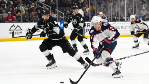 Columbus Blue Jackets' Adam Boqvist skates with the puck against the LA Kings' Drew Doughty in the third period at Crypto.com Arena.