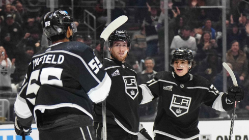 LA Kings center Pierre-Luc Dubois (80) celebrates after scoring a goal with right wing Quinton Byfield (55) and center Alex Turcotte (38) as Columbus Blue Jackets goaltender Elvis Merzlikins (90) reacts in the second period at Crypto.com Arena.