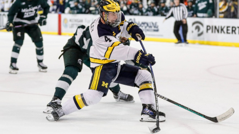 Michigan right wing Gavin Brindley shoots the puck against Michigan State during the third period at Yost Ice Arena in Ann Arbor on Friday, Feb. 9, 2024.