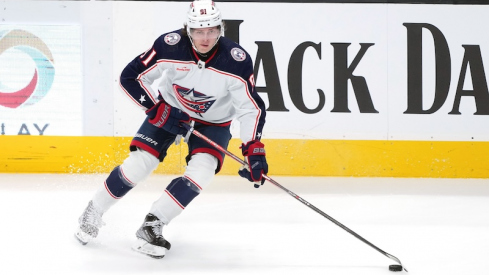 Columbus Blue Jackets' Kent Johnson skates with the puck against the San Jose Sharks during the third period at SAP Center at San Jose.