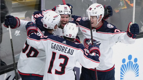 Columbus Blue Jackets center Boone Jenner (38) celebrates with center Jack Roslovic (96) and left wing Johnny Gaudreau (13) and defenseman Damon Severson (78) after scoring a goal against the San Jose Sharks during the third period at SAP Center at San Jose.