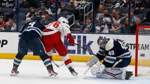 Carolina Hurricanes defenseman Brady Skjei (76) slides the puck through the pads of Columbus Blue Jackets goalie Daniil Tarasov (40) for a gaol during the second period at Nationwide Arena.