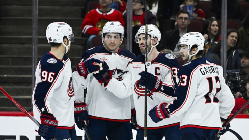 Columbus Blue Jackets' Boone Jenner celebrates his goal against the Chicago Blackhawks with teammates during the first period at the United Center.