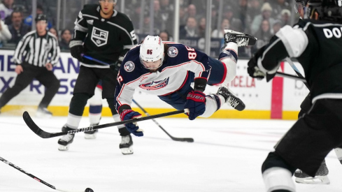 Columbus Blue Jackets' Kirill Marchenko dives for the puck against the LA Kings in the first period at Crypto.com Arena.