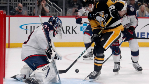 Columbus Blue Jackets goaltender Jet Greaves (73) makes a save against Pittsburgh Penguins right wing Valtteri Puustinen (48) during the first period at PPG Paints Arena.