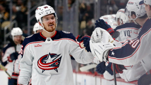 Columbus Blue Jackets center Jack Roslovic (96) celebrates with the Blue Jackets bench after scoring a goal against the Pittsburgh Penguins during the third period at PPG Paints Arena. The Penguins won 5-3.