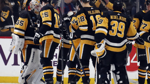 The Pittsburgh Penguins celebrate after defeating the Columbus Blue Jackets at PPG Paints Arena