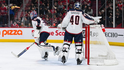 Columbus Blue Jackets' Elvis Merzlikins skates back to the locker room while looking towards the bench as Daniil Tarasov takes over the net against the Montreal Canadiens during the first period at Bell Centre.