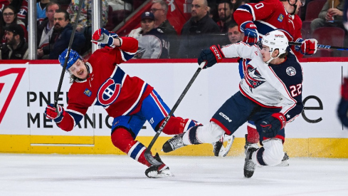 Montreal Canadiens left wing Michael Pezzetta (55) and Columbus Blue Jackets defenseman Jake Bean (22) collide with each other and fall on the ice during the first period at Bell Centre.