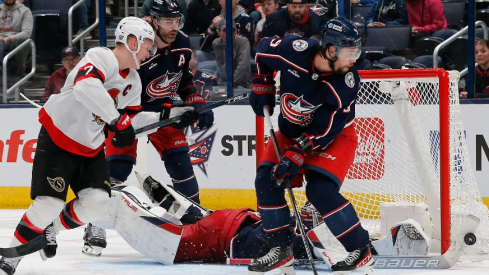 Columbus Blue Jackets goalie Elvis Merzlikins (90) makes a stick save against the Ottawa Senators during overtime at Nationwide Arena.