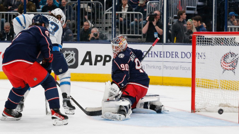 Winnipeg Jets right wing Tyler Toffoli (73) shot attempt slides wide of the goal against the Columbus Blue Jackets during the first period at Nationwide Arena.