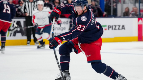 Columbus Blue Jackets defenseman Jake Christiansen (23) shoots the puck against the Washington Capitals in the second period at Nationwide Arena.