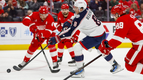 Columbus Blue Jackets' Zach Werenski shoots the puck during the first period of the game against the Detroit Red Wings at Little Caesars Arena.