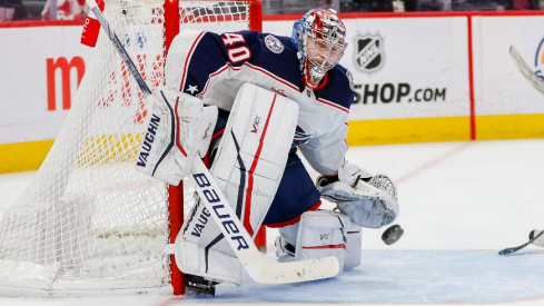 Columbus Blue Jackets goaltender Daniil Tarasov (40) attempts to block a shot during the third period of the game against the Detroit Red Wings at Little Caesars Arena.