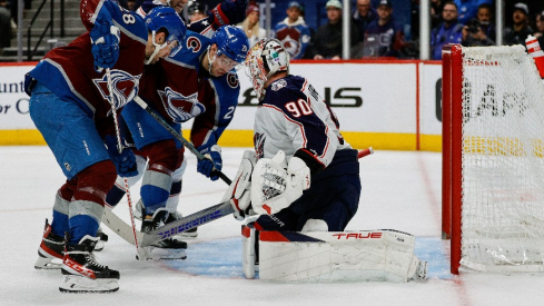 Colorado Avalanche center Ross Colton (20) pushes the puck past Columbus Blue Jackets goaltender Elvis Merzlikins (90) for a goal as left wing Miles Wood (28) and defenseman Damon Severson (78) look on in the second period at Ball Arena.