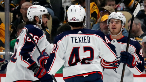 Columbus Blue Jackets right wing Kirill Marchenko (86) and center Alexandre Texier (42) congratulate center Cole Sillinger (right) on his goal against the Pittsburgh Penguins during the second period at PPG Paints Arena.