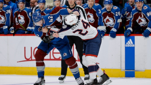 Colorado Avalanche's Josh Manson and Columbus Blue Jackets' Mathieu Olivier fight in the third period at Ball Arena.