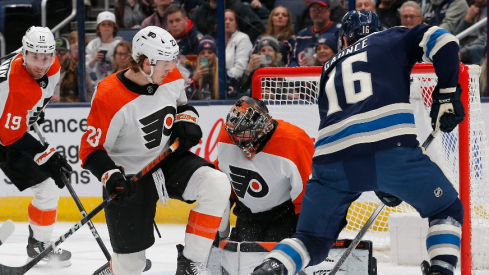 Philadelphia Flyers goalie Samuel Ersson (33) makes a save as Columbus Blue Jackets center Brendan Gaunce (16) looks for a rebound during the first period at Nationwide Arena.