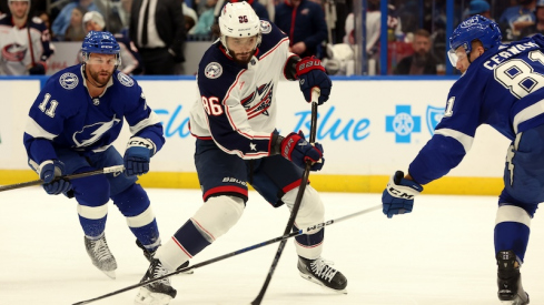 Columbus Blue Jackets' Kirill Marchenko scores a goal as Tampa Bay Lightning's Erik Cernak and Luke Glendening attempted to defend during the second period at Amalie Arena.