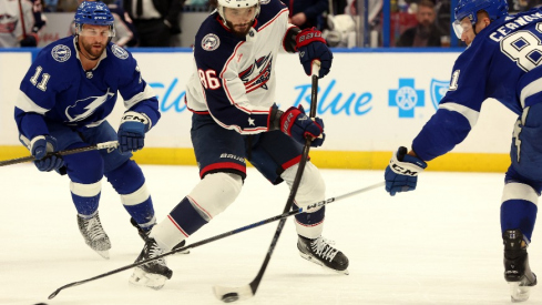 Columbus Blue Jackets right wing Kirill Marchenko (86) scores a goal as Tampa Bay Lightning defenseman Erik Cernak (81) and center Luke Glendening (11) attempted to defend during the second period at Amalie Arena.