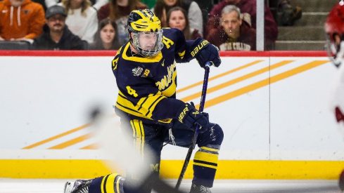 Michigan forward Gavin Brindley (4) shoots the puck against Boston College during the third period of the Frozen Four semifinal game at Xcel Energy Center in St. Paul, Minn. on Thursday, April 11, 2024.