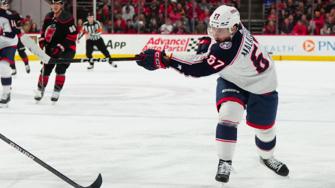 Columbus Blue Jackets left wing James Malatesta takes a shot against the Carolina Hurricanes