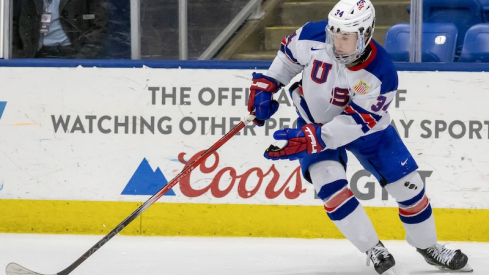 USA's Cole Eiserman (34) controls the puck against Finland during the third period of the 2024 U18 s Five Nations Tournament at USA Hockey Arena.