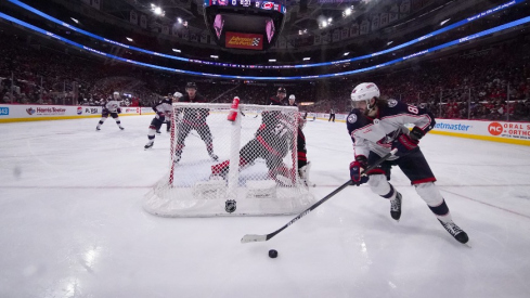 Columbus Blue Jackets right wing Kirill Marchenko (86) skates with the puck behind the net against the Carolina Hurricanes during the second period at PNC Arena.