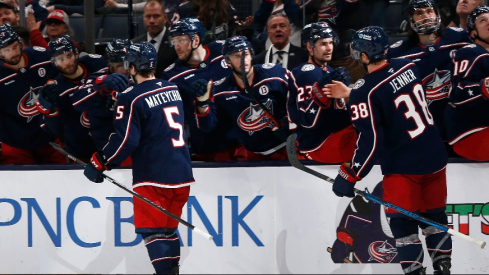 In a game that had everything, Boone Jenner's two-goal effort helped the Columbus Blue Jackets outlast the Vancouver Canucks in a 7-6 shootout victory Friday night..