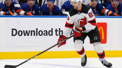 New Jersey Devils defenseman Christian Jaros (83) controls the puck against New York Islanders during the third period at UBS Arena.