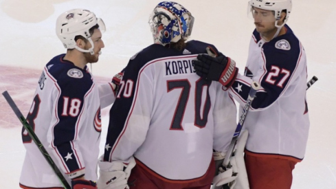 Columbus Blue Jackets goalie Joonas Korpisalo (70) is consoled by teammates after a 3-2 loss to Tampa Bay Lightning in the fifth overtime period in game one of the first round of the 2020 Stanley Cup Playoffs at Scotiabank Arena.