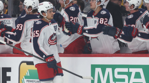 Columbus Blue Jackets center Luca Del Bel Belluz (65) celebrates his goal with the Blue Jackets bench against the Pittsburgh Penguins during the first period at PPG Paints Arena.