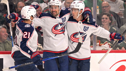 Oct 11, 2025; Saint Paul, Minnesota, USA; Columbus Blue Jackets forward Miles Wood (11) celebrates his goal against the Minnesota Wild with forward Isac Lundestrom (21) and defensemen Damon Severson (78) during the first period at Grand Casino Arena.