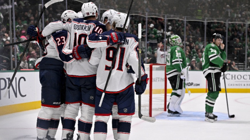 Oct 21, 2025; Dallas, Texas, USA; Columbus Blue Jackets left wing Dmitri Voronkov (10) celebrates with his teammates after scoring a power play goal against the Dallas Stars as goaltender Jake Oettinger (29) and defenseman Esa Lindell (23) look on during the third period at the American Airlines Center.