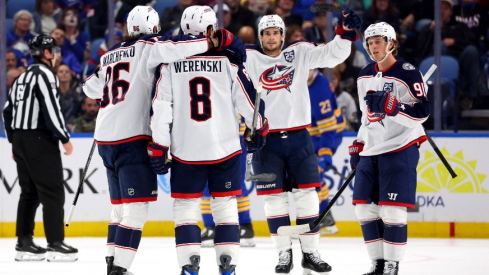 Oct 28, 2025; Buffalo, New York, USA; Columbus Blue Jackets defenseman Zach Werenski (8) celebrates his goal with teammates during the second period against the Buffalo Sabres at KeyBank Center.