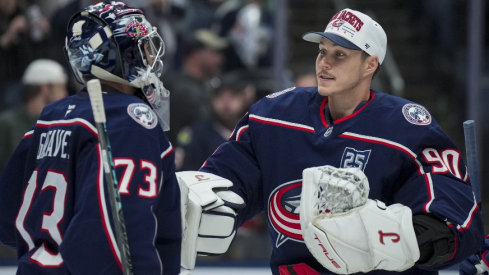 Nov 1, 2025; Columbus, Ohio, USA; Columbus Blue Jackets goaltender Jet Greaves (73) celebrates with goaltender Elvis Merzlikins (90) after defeating the St. Louis Blues at Nationwide Arena.