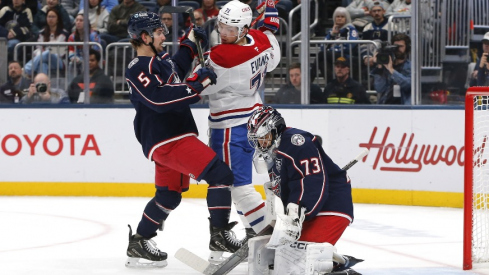 Nov 17, 2025; Columbus, Ohio, USA; Columbus Blue Jackets goalie Jet Greaves (73) makes a save as Montreal Canadiens center Jake Evans (71) looks for a rebound during the first period at Nationwide Arena.