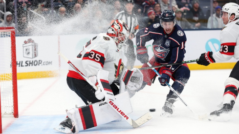 Dec 11, 2025; Columbus, Ohio, USA; Ottawa Senators goaltender Linus Ullmark (35) saves the puck as Columbus Blue Jackets left wing Miles Wood (11) looks for a shot during the second period at Nationwide Arena.