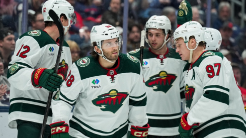 Dec 18, 2025; Columbus, Ohio, USA; Minnesota Wild right wing Ryan Hartman (38) celebrates with teammates after scoring a goal against Columbus Blue Jackets in the second period at Nationwide Arena.