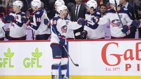 Columbus Blue Jackets center Boone Jenner celebrates with the team 