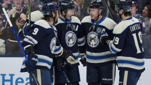 Nov 28, 2025; Columbus, Ohio, USA; Columbus Blue Jackets defenseman Zach Werenski (8) celebrates with teammates after scoring a goal against the Pittsburgh Penguins in the second period at Nationwide Arena.