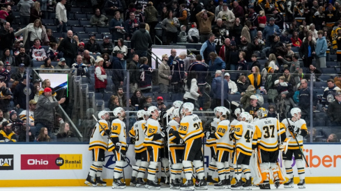 Jan 4, 2026; Columbus, Ohio, USA; Pittsburgh Penguins center Sidney Crosby (87) celebrates with teammates after scoring the game-winning goal against the Columbus Blue Jackets in the overtime period at Nationwide Arena.
