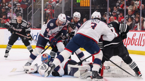Feb 3, 2026; Newark, New Jersey, USA; Columbus Blue Jackets goaltender Elvis Merzlikins (90) makes a save against the New Jersey Devils during the second period at Prudential Center.