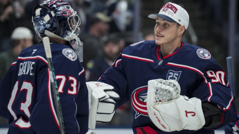 Nov 1, 2025; Columbus, Ohio, USA; Columbus Blue Jackets goaltender Jet Greaves (73) celebrates with goaltender Elvis Merzlikins (90) after defeating the St. Louis Blues at Nationwide Arena.