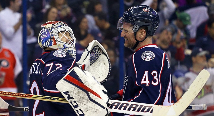 Sergei Bobrovsky and Scott Hartnell celebrate the Blue Jackets' 1-0 win over the Flyers