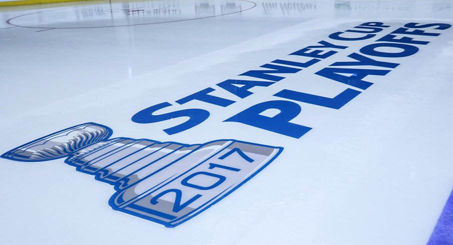 Stanley Cup Playoffs logo on the Nationwide Arena ice.