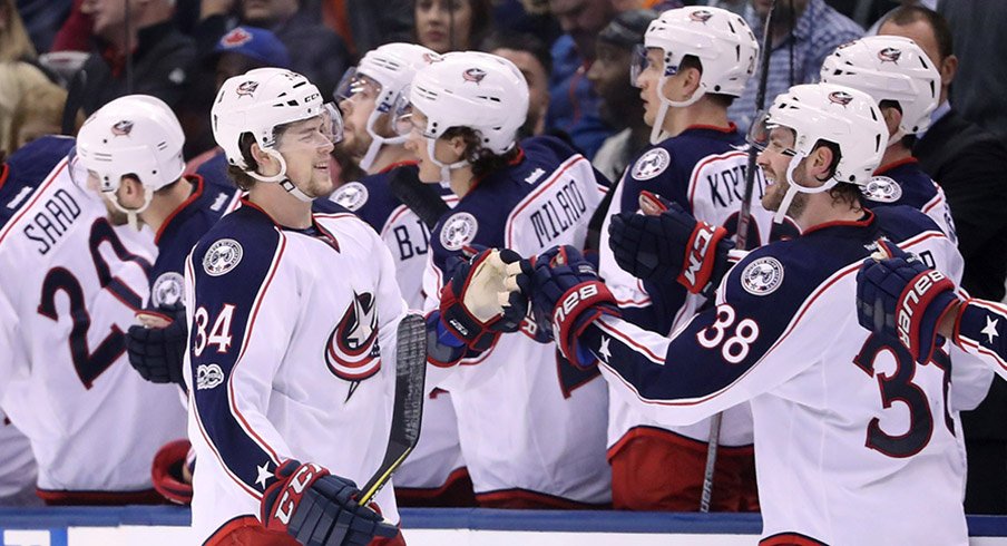 Columbus Blue Jackets right wing Josh Anderson (34) celebrates his short-handed goal with center Boone Jenner (38) against the Toronto Maple Leafs at Air Canada Centre. The Blue Jackets beat the Maple Leafs 3-2. 